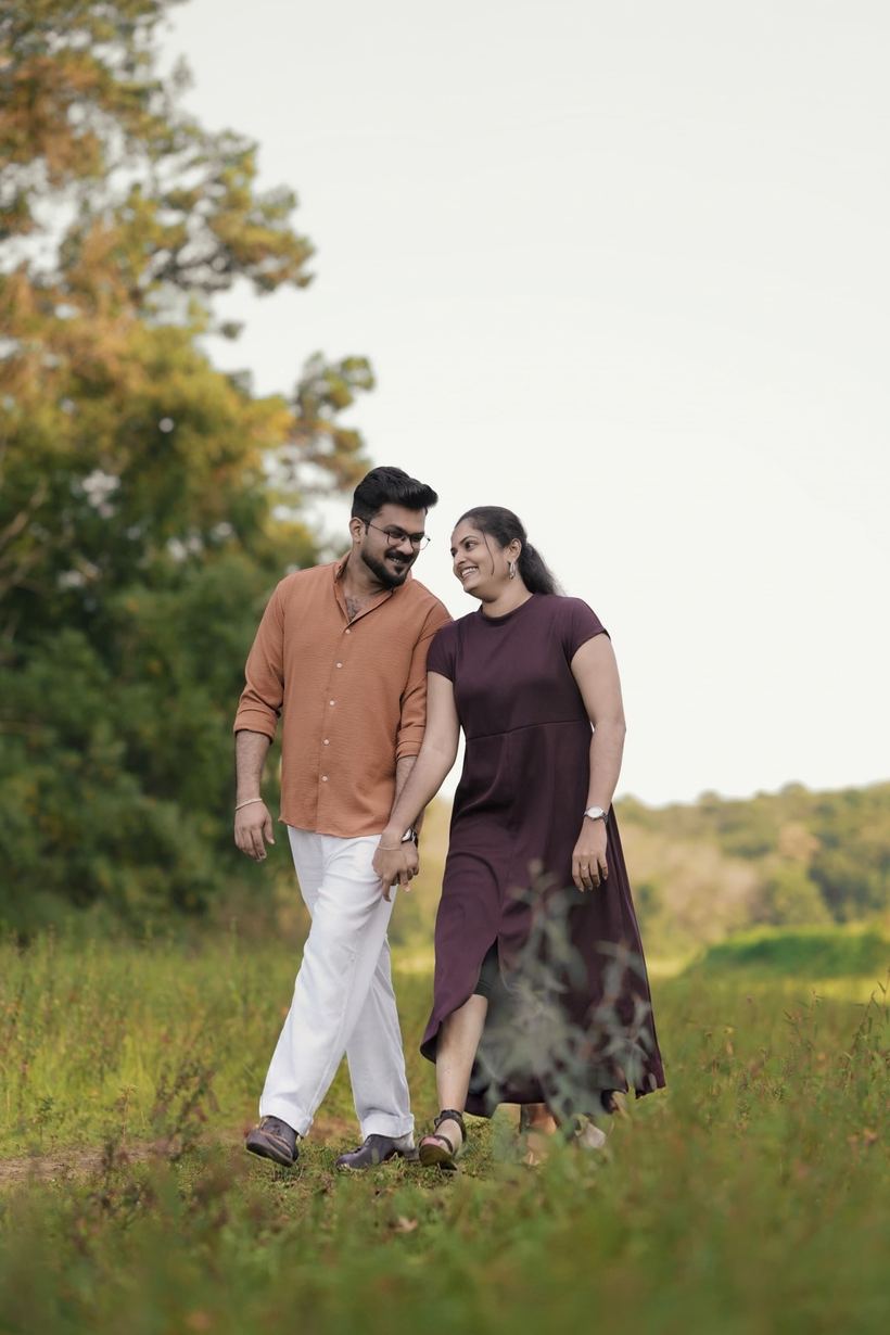Meghna and Shimil walking through a field